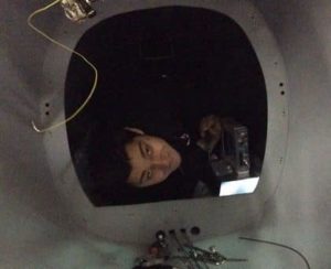 Assembly Tech Tony Hatziliadis gazing back through the Bulkhead A hatch.