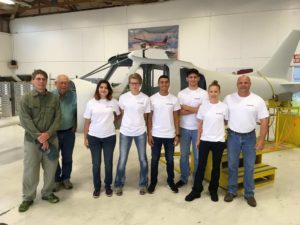 The 2017 Build-A-Plane crew. From left, Mike Baur, builder/owner Ken Baur, students Amber McCutcheon, Kodee Scott, Michael Gomez and Bryant Castro, teacher/coach Sabrina Laurent and her husband (and team chaperon) Jim Laurent. The Olney, Texas, contingent proudly wears T-shirts provided by Day One's sponsor, Garmin.