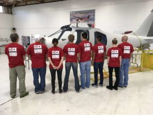 The Build-A-Plane team showing off their day's T-shirts.